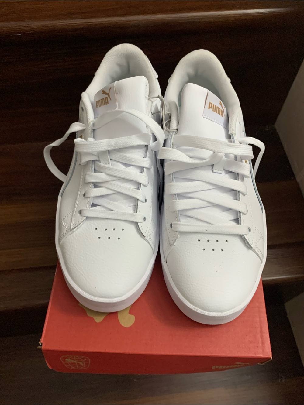New woman’s Puma White Low-Top Sneakers with Gold Branding. Size 8